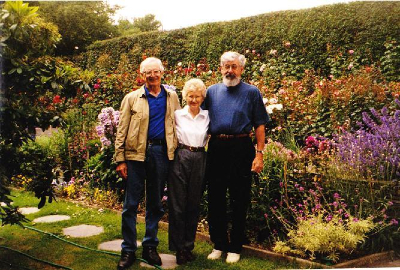 friends standing in a garden